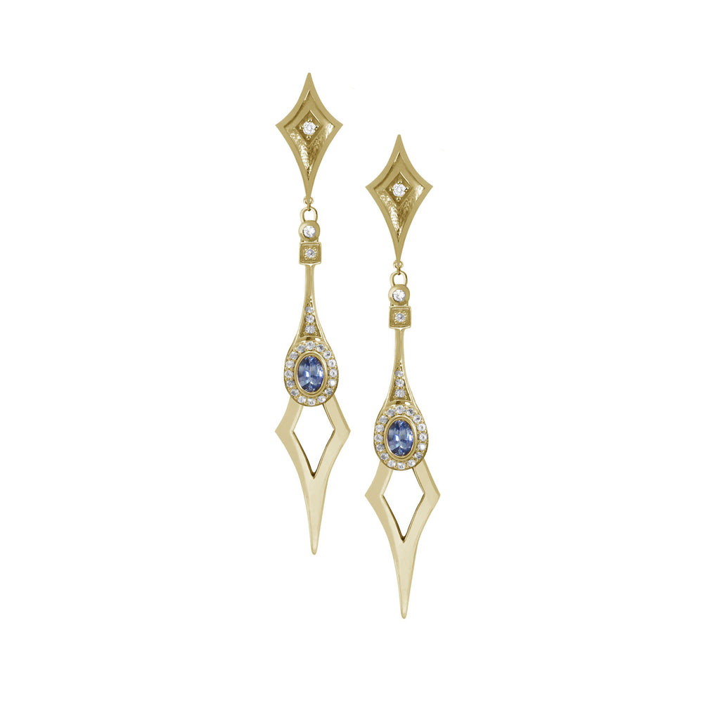 18 karat yellow gold statement drop earrings with a shield-shaped stud with a diamond. The Drop part of the earring is a pale blue sapphire and diamond halo finished with a n elongated point.