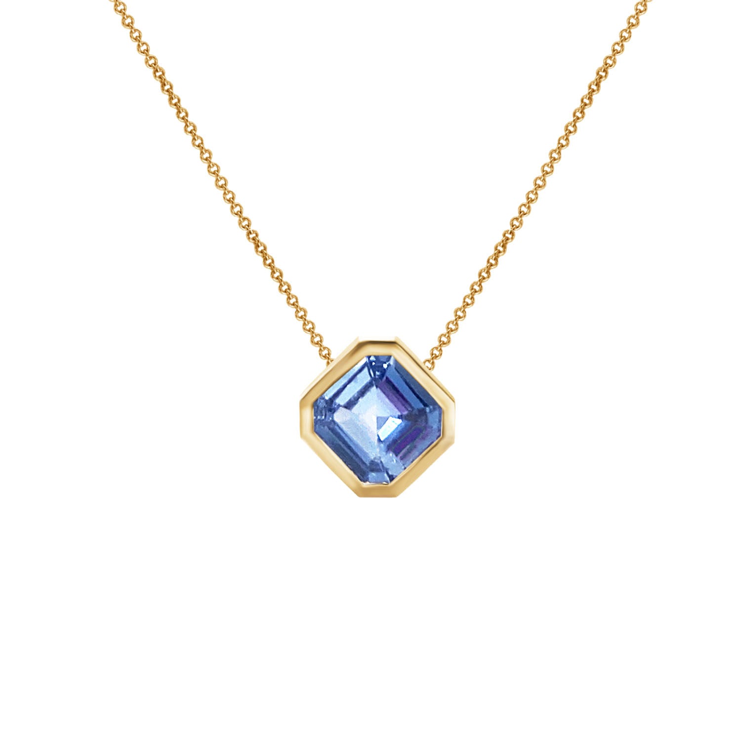 Layering necklace with Asscher cut Ceylon sapphire on white background. Collier à saphir sur fond blanc. Montréal, Canada
