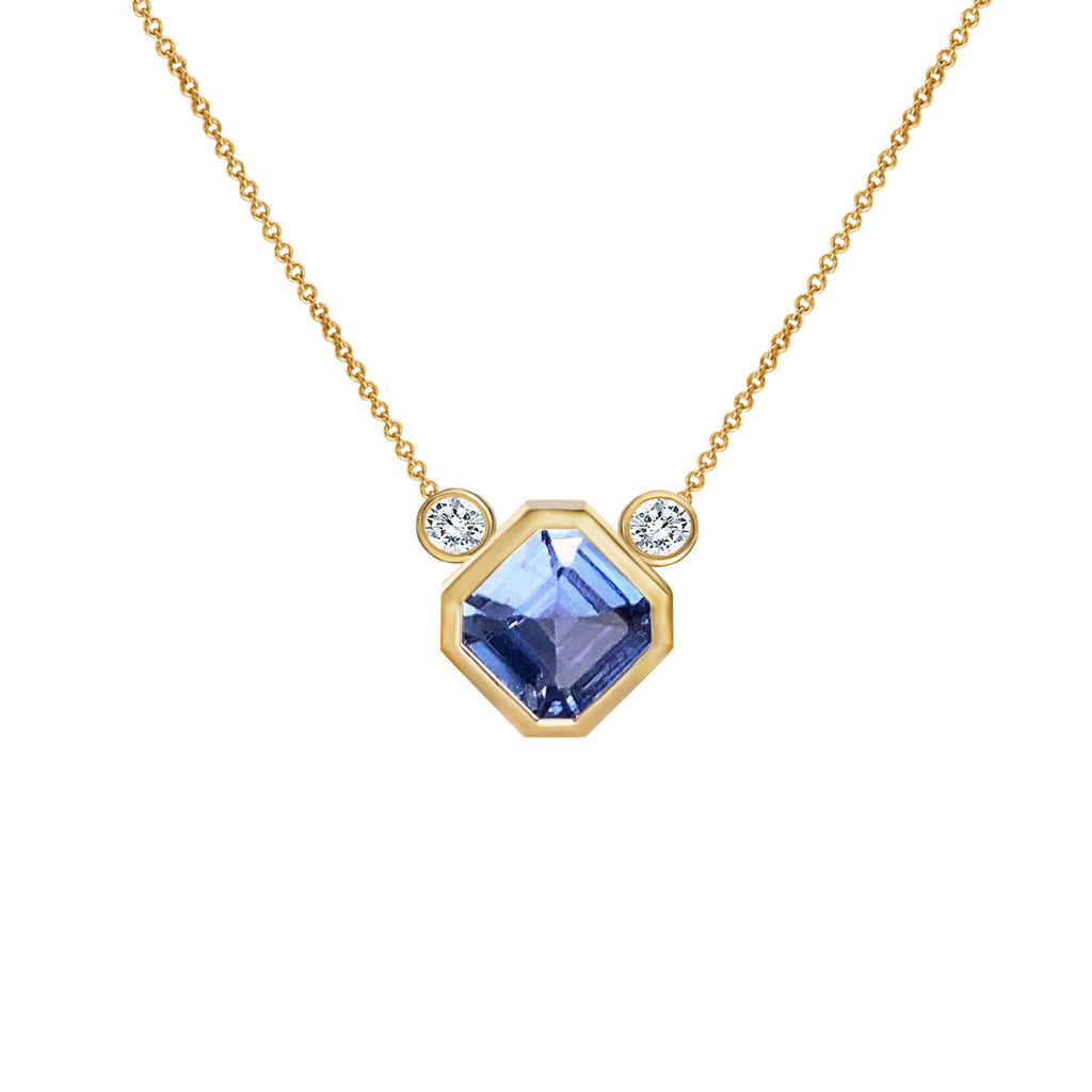 Layering necklace with Asscher cut Ceylon sapphire and two white diamonds on white background. Collier à saphir et diamants sur fond blanc. Montréal, Canada