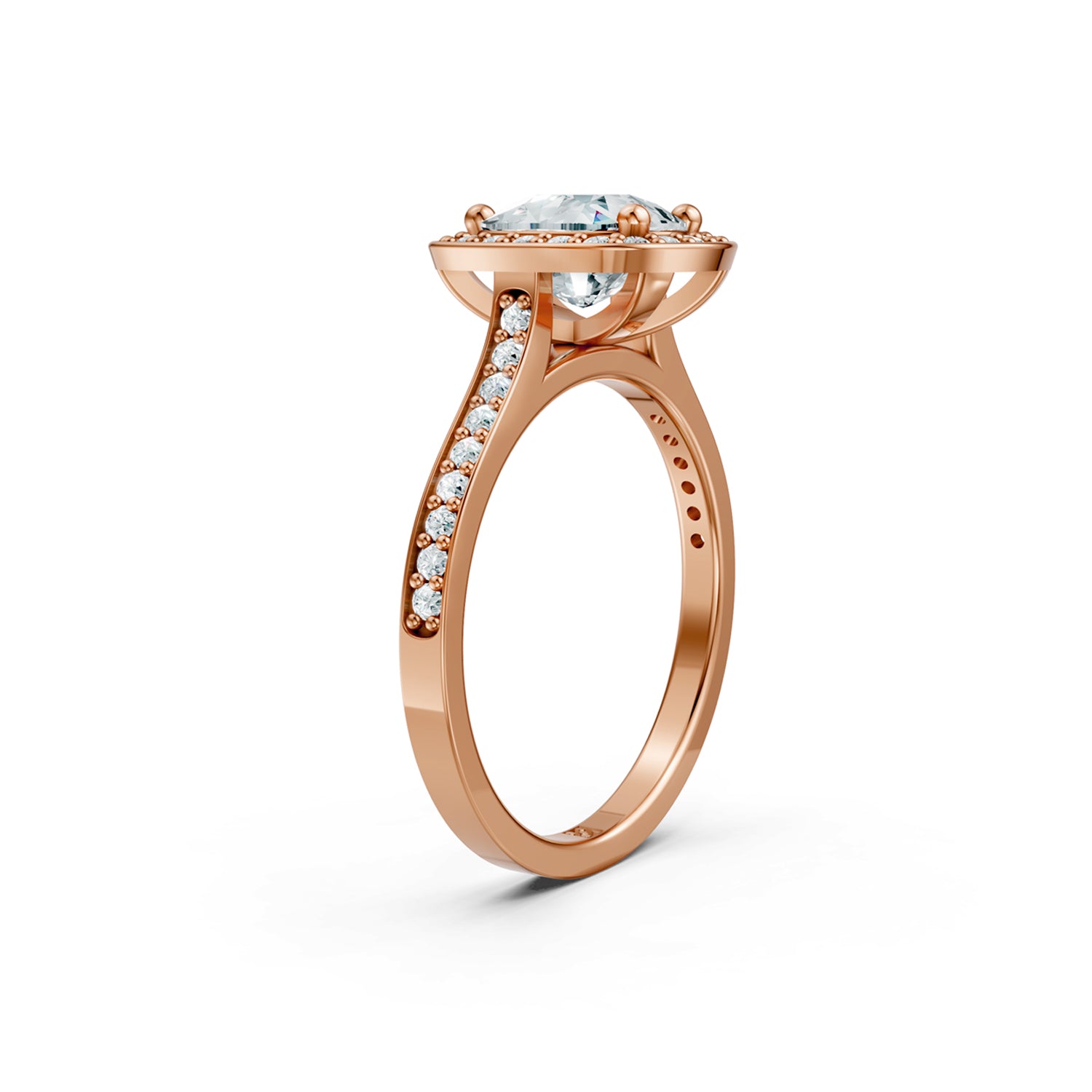 Beautifuly pink or rose gold diamond halo engagement ring with 2 carat centre diamond and a row of bright, white diamonds running down the engagement ring band. Made in Canada. Bague fiançailles à diamants halo . Création Montréal. Style Couture Classique.