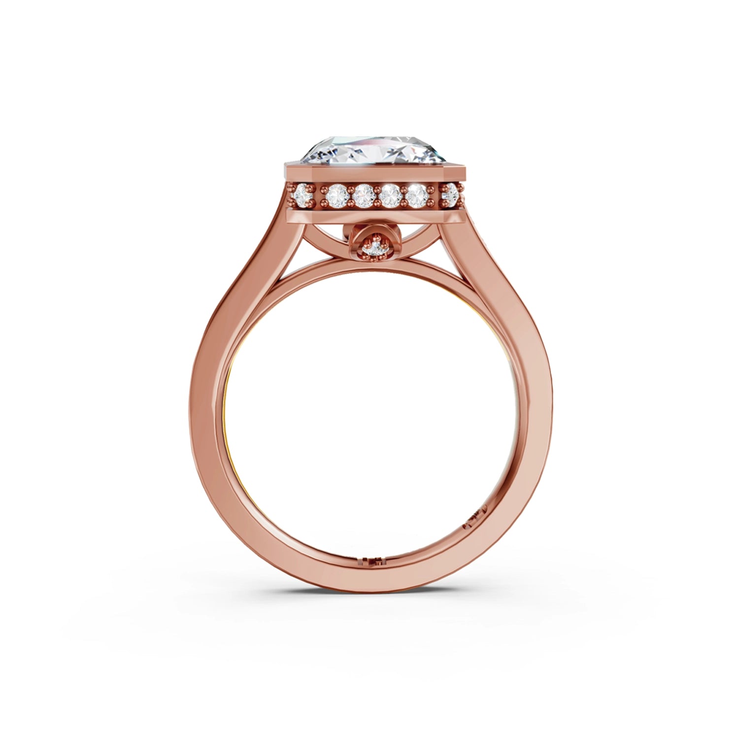 Beautiful pink gold radiant diamond bezel engagement ring with hidden halo, 2 carat centre diamond and a row of bright, white diamonds running down the engagement ring band on white background. Made in Canada. Bague fiançailles à diamants avec halo caché et diamants sur l'anneau sur fond blanc. Fabriquée à Montréal. Style serti clos.
