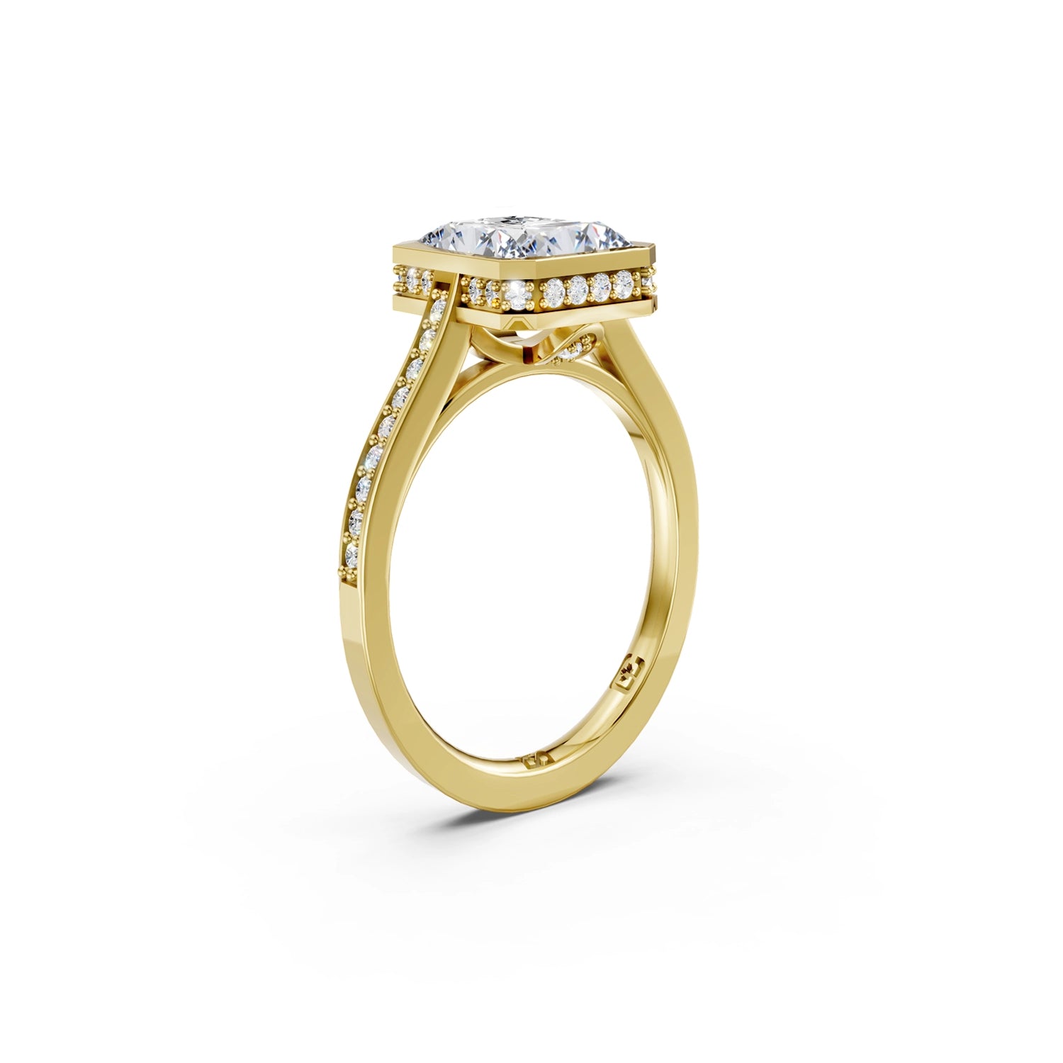 Beautiful yellow gold radiant diamond bezel engagement ring with hidden halo, 2 carat centre diamond and a row of bright, white diamonds running down the engagement ring band on white background. Made in Canada. Bague fiançailles à diamants avec halo caché et diamants sur l'anneau sur fond blanc. Fabriquée à Montréal. Style serti clos.