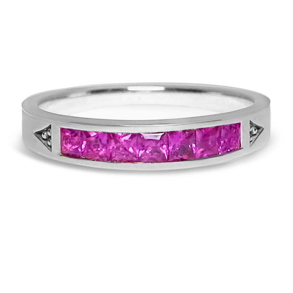White gold stacking ring with 7 princess bright pinks sapphires.