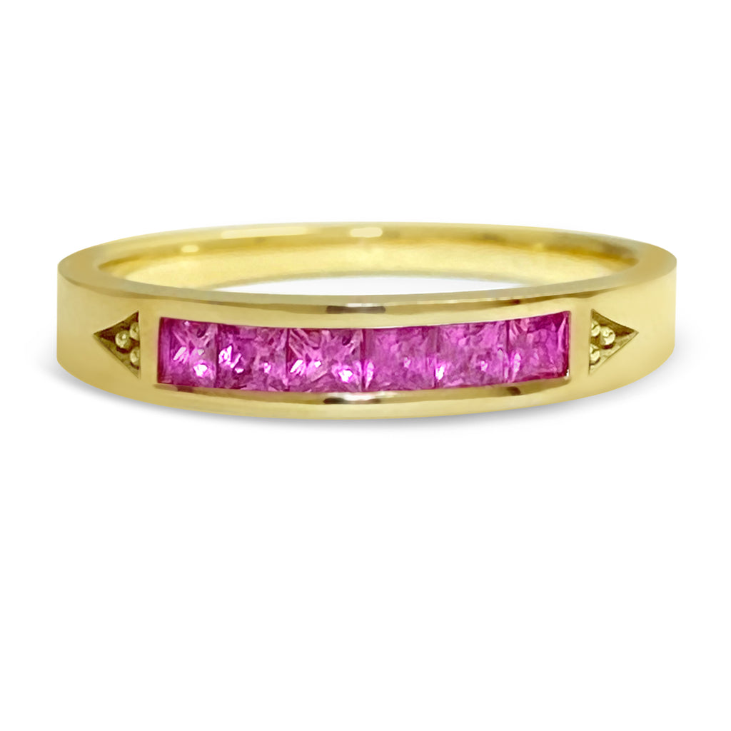 Yellow gold stacking ring with 6 princess bright pinks sapphires.