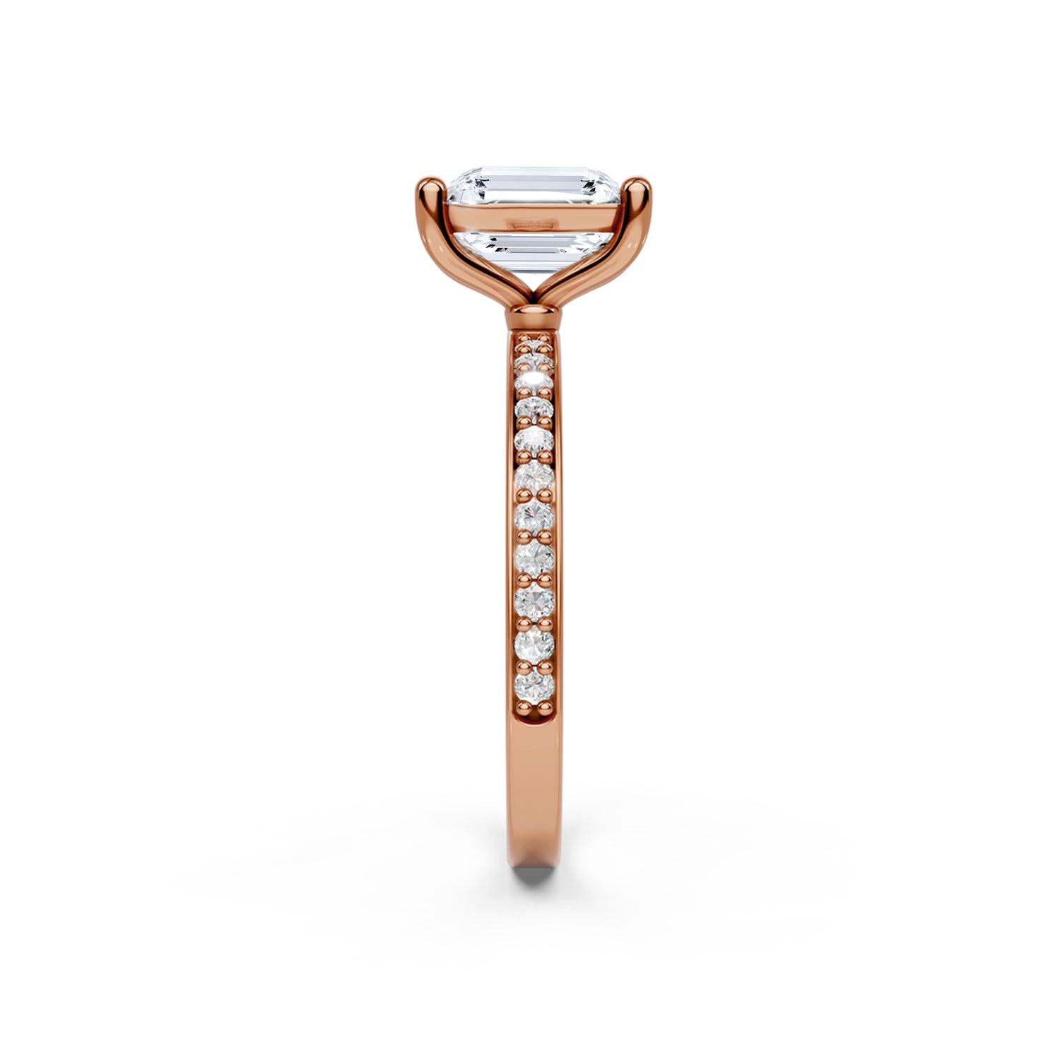 Stunning pink or rose gold Solitaire Engagement Ring with large emerald shaped  diamond and sparkling diamonds running down the narrow band. Made in Montreal. Contemporary and Classic Design. Perfect for a Millennial Bride /  Marriage Montréal Bague de fiancailles haut de gamme Bijoux Montréal