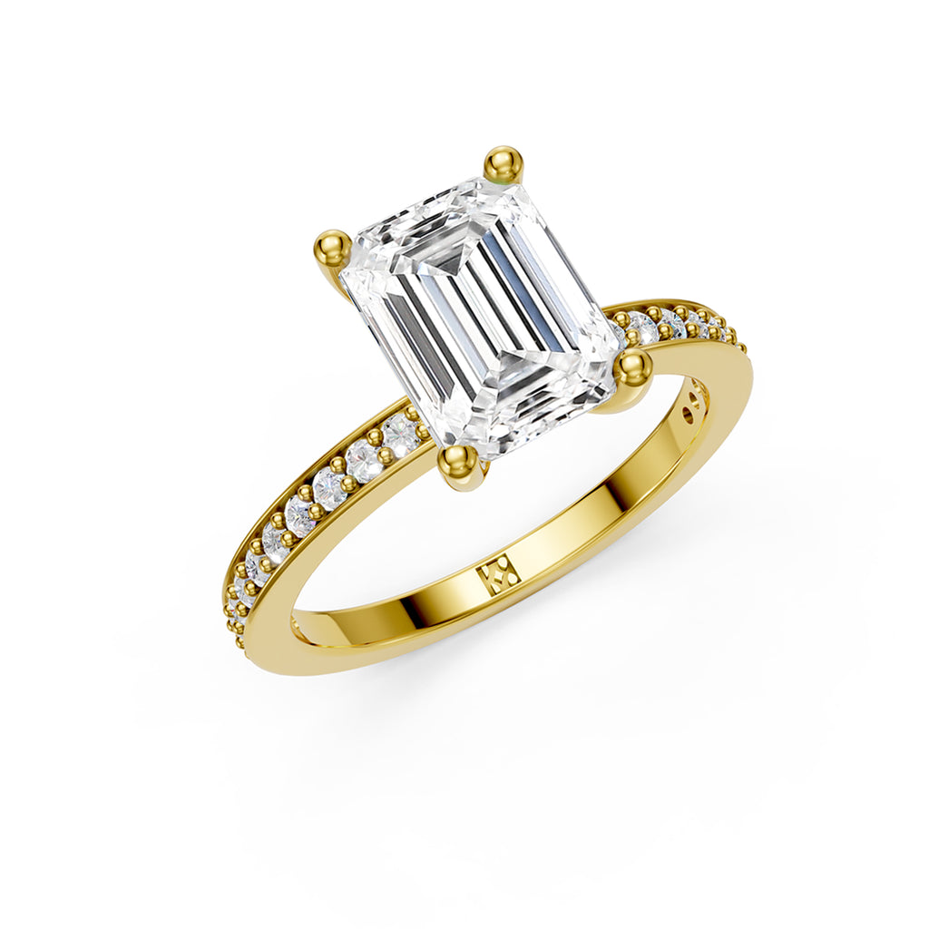 Stunning yellow gold Solitaire Engagement Ring with large emerald shaped  diamond and sparkling diamonds running down the narrow band. Made in Montreal. Contemporary and Classic Design. Perfect for a Millennial Bride /  Marriage Montréal Bague de fiancailles haut de gamme Bijoux Montréal